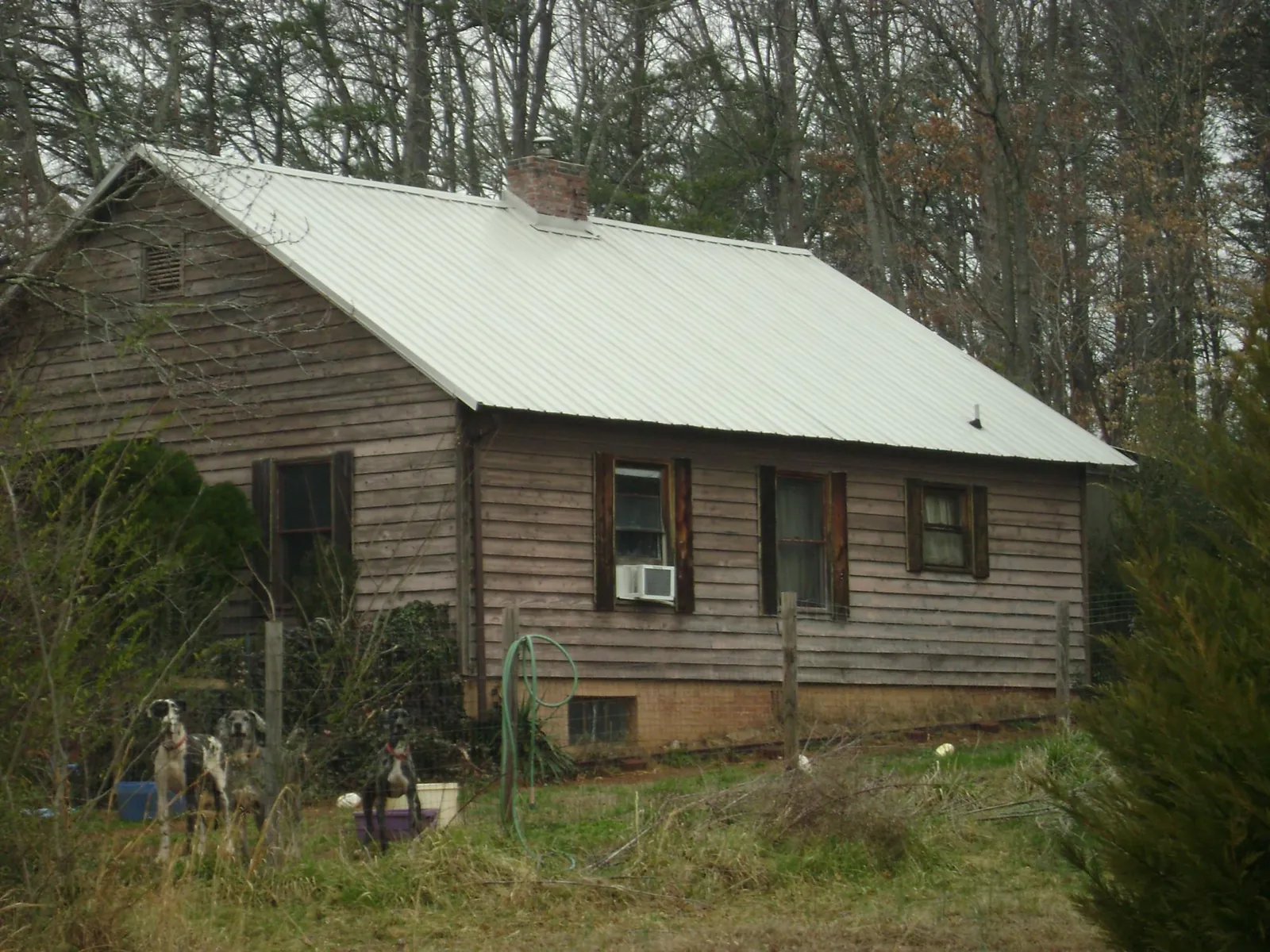 White metal roof on an old wood sided farmhouse, from a Asphalt Shingle Roof Repair job in Tujunga